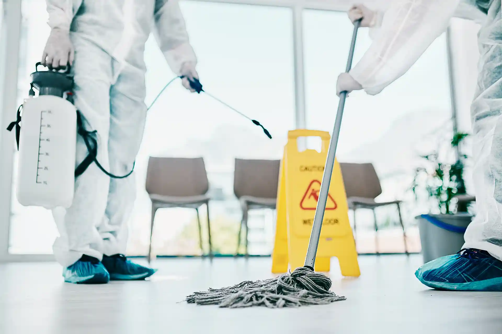 Moping and disinfecting floor.