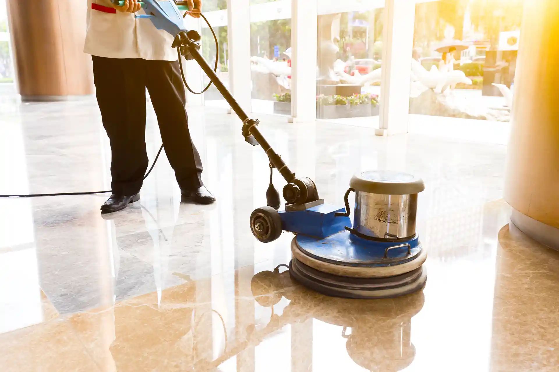Cleaning hard floor with machine.