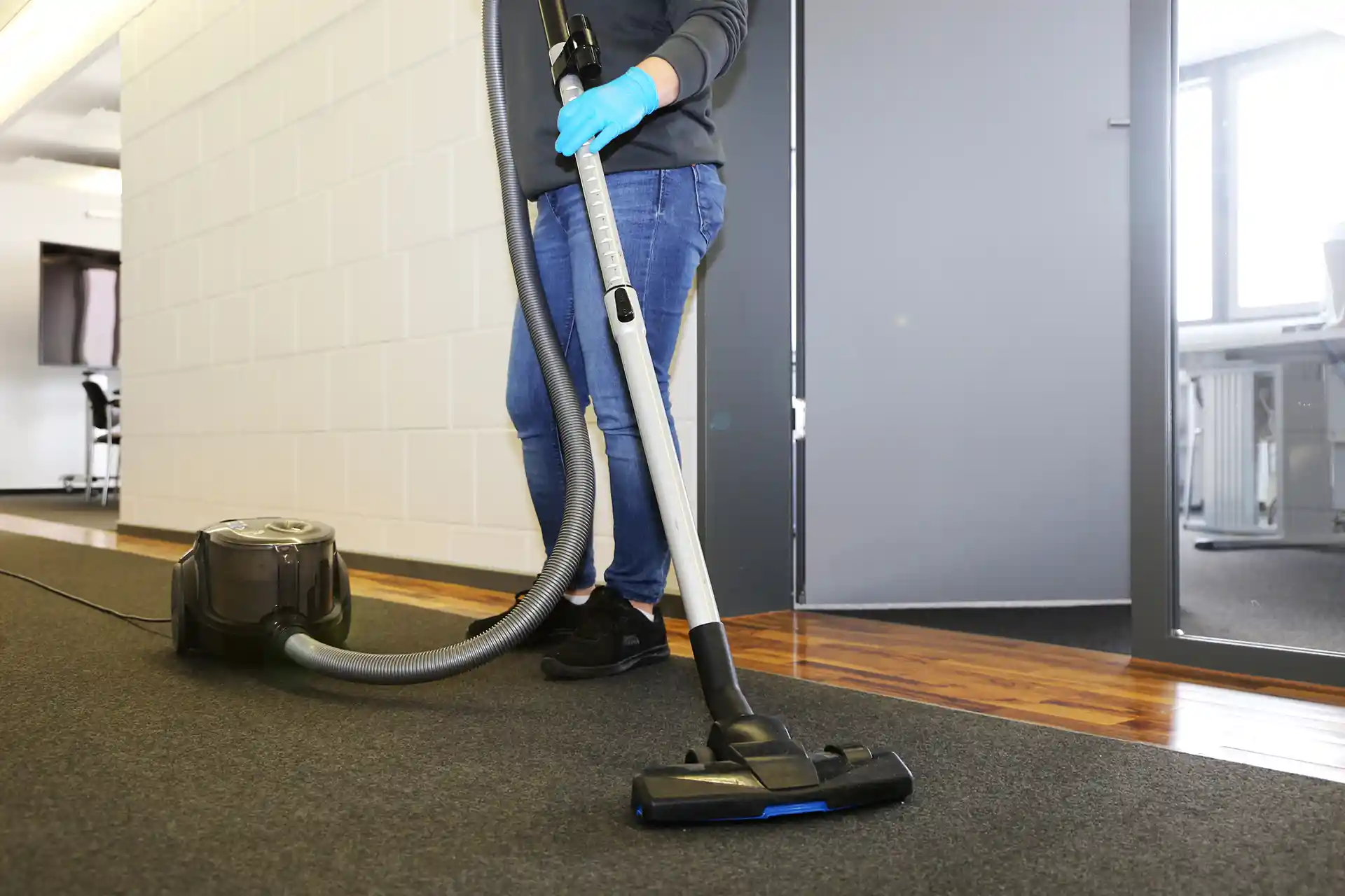 Vacuuming floor.