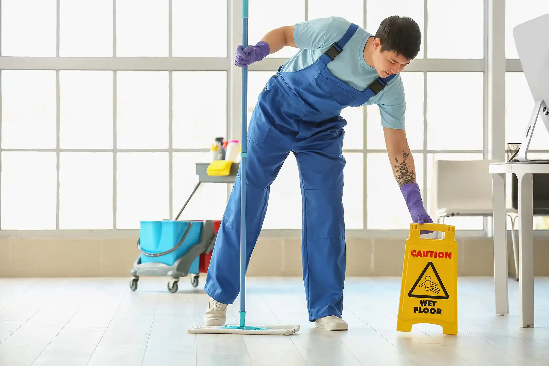 Janitor cleaning a office space.